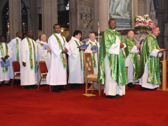 The Archbishop of Dublin Diarmuid Martin, Auxiliary Bishop of Dublin Raymond Field and Chaplain of the African Chaplaincy Fr Cornelius Nwaogwugwu CM are joined by other priests at a celebration of Mass.